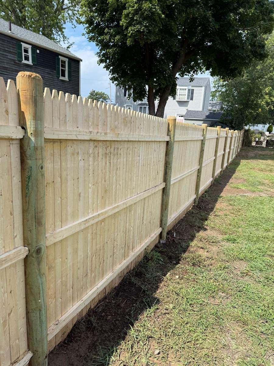 Wooden privacy fence installed by Vcoelho General Services in Massachusetts